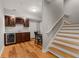 Finished basement features a kitchenette and a wooden staircase leading to the upper level at 12120 Dancliff Trce, Alpharetta, GA 30009