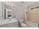 Bathroom with a vanity, toilet, and shower/tub combination at 12120 Dancliff Trce, Alpharetta, GA 30009