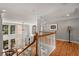 Bright foyer with hardwood floors, soaring windows, and an open view to the living room at 12120 Dancliff Trce, Alpharetta, GA 30009