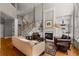 Bright living room with hardwood floors, fireplace, and built-in shelving at 12120 Dancliff Trce, Alpharetta, GA 30009