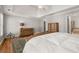 Comfortable main bedroom featuring hardwood floors and a tray ceiling at 12120 Dancliff Trce, Alpharetta, GA 30009