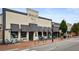 Charming street view with a SMOKEJACK restaurant featuring outdoor seating and unique architectural details at 12120 Dancliff Trce, Alpharetta, GA 30009