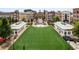 Aerial view of the town center with shops and a green space at 12120 Dancliff Trce, Alpharetta, GA 30009