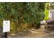 A tree lined walking trail is seen surrounded by green foliage and marked by a sign at 12120 Dancliff Trce, Alpharetta, GA 30009