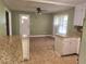 Open kitchen and dining area with tiled floor and granite countertops at 1256 E Piedmont Rd, Marietta, GA 30062