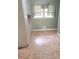 This is the Kitchen and it has neutral tiled floor and a bright window at 1256 E Piedmont Rd, Marietta, GA 30062