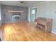 Inviting living room features a brick fireplace and gleaming hardwood floors at 1256 E Piedmont Rd, Marietta, GA 30062