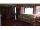 A cozy living room featuring a floral sofa, an accent chair, and hardwood floors at 1256 E Piedmont Rd, Marietta, GA 30062