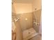 A tiled shower area with neutral-colored tiles and a gray mosaic-patterned floor at 1256 E Piedmont Rd, Marietta, GA 30062