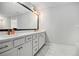 Elegant bathroom with dual sinks, marble countertops, and stylish gold fixtures at 3717 Silvery Way, Powder Springs, GA 30127