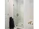 Modern bathroom featuring a glass-enclosed shower with marble tile and sleek fixtures at 3717 Silvery Way, Powder Springs, GA 30127