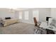 Bedroom with neutral carpet, ample natural light, and a dedicated workspace at 3717 Silvery Way, Powder Springs, GA 30127