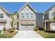 Charming townhouse with a two-car garage and a mix of brick and shingle siding at 3717 Silvery Way, Powder Springs, GA 30127