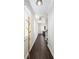 Bright hallway featuring hard wood floors and modern lighting fixtures at 3717 Silvery Way, Powder Springs, GA 30127