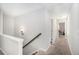 Upstairs hallway with carpet floors and access to the bedrooms and other rooms at 3717 Silvery Way, Powder Springs, GA 30127