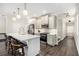 Well-equipped kitchen with a large island, seating, and modern stainless steel appliances for cooking at 3717 Silvery Way, Powder Springs, GA 30127