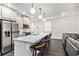 Spacious kitchen with a large island, stainless steel refrigerator, and bar stool seating for casual dining at 3717 Silvery Way, Powder Springs, GA 30127