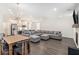 Bright and open living area with modern furnishings and kitchen in the background at 3717 Silvery Way, Powder Springs, GA 30127