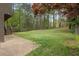 Expansive backyard featuring a patio and lush greenery, perfect for outdoor enjoyment at 570 Bell Se Rd, Conyers, GA 30094