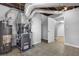 Basement with tile flooring, furnace, and water heater, plus access to another room at 570 Bell Se Rd, Conyers, GA 30094