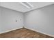 This basement has wood-look flooring and neutral colored walls at 570 Bell Se Rd, Conyers, GA 30094