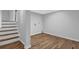 The basement features wood-look floors and stairs at 570 Bell Se Rd, Conyers, GA 30094