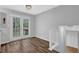 Dining area featuring hardwood floors and sliding glass doors at 570 Bell Se Rd, Conyers, GA 30094