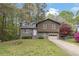 Charming split-level home with a well-maintained front yard and an attached one-car garage at 570 Bell Se Rd, Conyers, GA 30094