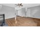 Spacious living room featuring hardwood floors, stairs to the second floor, and a light color palette at 570 Bell Se Rd, Conyers, GA 30094