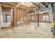 Unfinished basement ready for customization, featuring exposed ceiling, a staircase, and potential for versatile use at 6028 Connaught Se Dr, Mableton, GA 30126