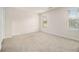 Neutral bedroom with carpet and two windows providing natural light at 6028 Connaught Se Dr, Mableton, GA 30126