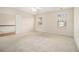 Spacious bedroom with two windows, a ceiling fan and an open doorway to the hallway at 6028 Connaught Se Dr, Mableton, GA 30126