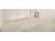 Bedroom with neutral carpet, white walls, baseboards, and doors and an open doorway at 6028 Connaught Se Dr, Mableton, GA 30126