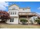 Two-story home with a wood deck, back patio, and vinyl siding offers outdoor living and classic curb appeal at 6028 Connaught Se Dr, Mableton, GA 30126