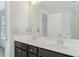 Bright bathroom with a double sink vanity and a large mirror at 6625 Story Cir, Norcross, GA 30093