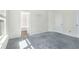 Comfortable bedroom with soft gray carpet, a sunny window, and easy access to the bath at 6625 Story Cir, Norcross, GA 30093