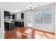 Well-lit kitchen with dark cabinets, stainless steel appliances, island, and lots of natural light at 6625 Story Cir, Norcross, GA 30093