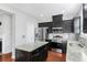 Stylish kitchen featuring granite countertops, stainless steel appliances, island, and ample cabinet space at 6625 Story Cir, Norcross, GA 30093