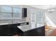 Light-filled kitchen with island, stainless steel dishwasher, granite countertops, and eat in breakfast area at 6625 Story Cir, Norcross, GA 30093