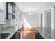 Bright kitchen area featuring granite countertops, lots of cabinet space, and access to an adjacent dining area at 6625 Story Cir, Norcross, GA 30093