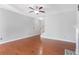 The expansive living room features hardwood floors, neutral walls, and a classic fireplace at 6625 Story Cir, Norcross, GA 30093