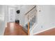Carpeted staircase features wooden handrails, leading to the upper level of the home at 6625 Story Cir, Norcross, GA 30093