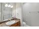 Clean bathroom featuring a vanity with sink, toilet, and shower-tub combo at 1250 Parkwood Se Cir # 2201, Atlanta, GA 30339