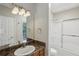 Bathroom featuring a shower-tub combo, vanity with sink, and ample lighting at 1250 Parkwood Se Cir # 2201, Atlanta, GA 30339