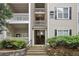 Condominium building entrance featuring well-maintained landscaping and multi-story access at 1250 Parkwood Se Cir # 2201, Atlanta, GA 30339