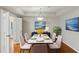 Charming dining room with modern lighting fixture and hardwood floors at 1250 Parkwood Se Cir # 2201, Atlanta, GA 30339
