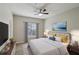 Bright main bedroom with a ceiling fan, window, and contemporary decor at 1250 Parkwood Se Cir # 2201, Atlanta, GA 30339