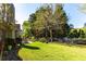 Expansive backyard with lush lawn and mature trees, ideal for outdoor activities and relaxation at 1630 Chadwick Mill Ln, Lawrenceville, GA 30043