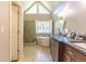 Bright bathroom with a modern soaking tub, glass-enclosed shower, and double vanity sinks at 1630 Chadwick Mill Ln, Lawrenceville, GA 30043