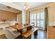 Open dining area showcasing a large wooden table, elegant lighting, and stylish decor at 1630 Chadwick Mill Ln, Lawrenceville, GA 30043